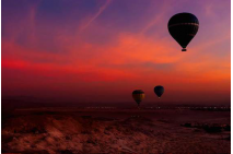 Hot Air Balloon Over Egyptian Valley of The Kings at *Sunset